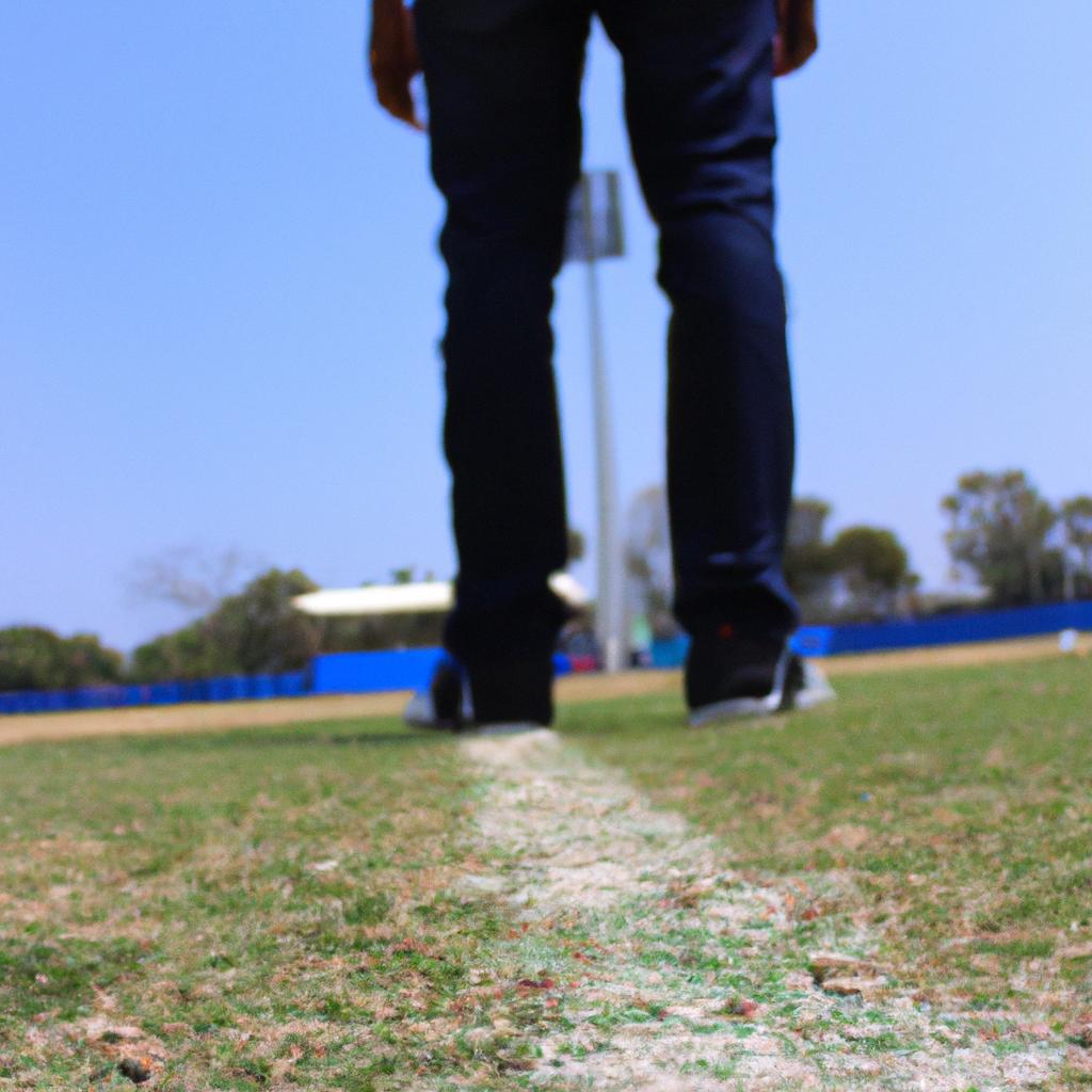 Person standing in cricket field