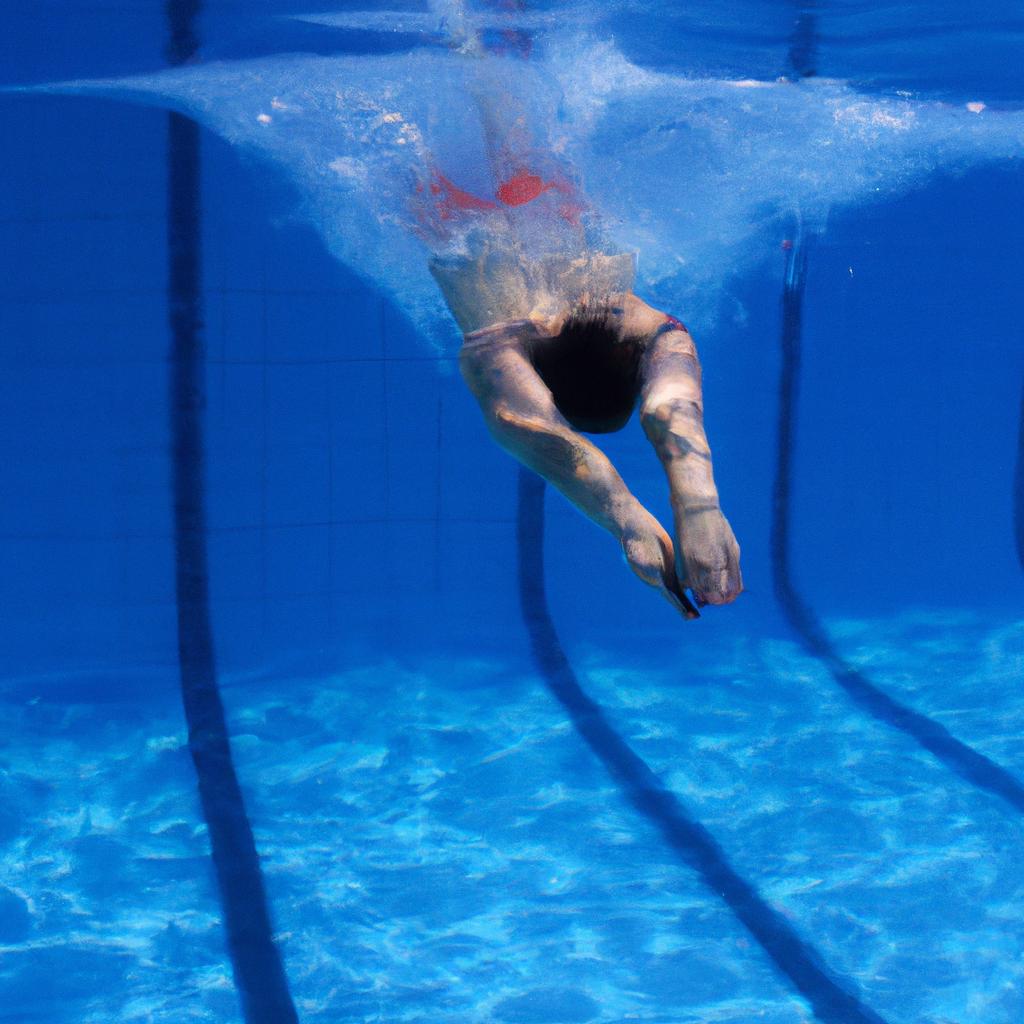 Swimmer diving into a pool